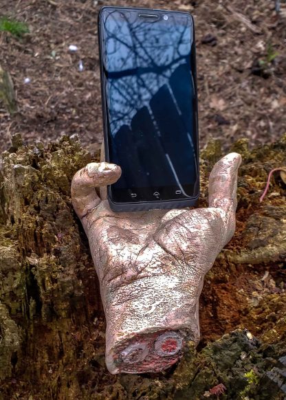 severed zombie hand phone holder