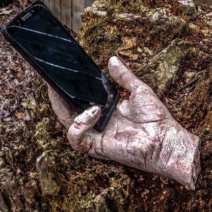 severed zombie hand phone holder